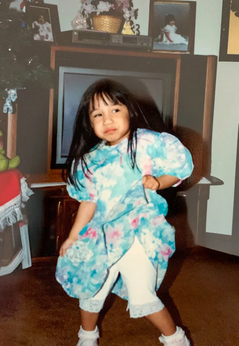 Rachel as a child, mid-dance in the living room.